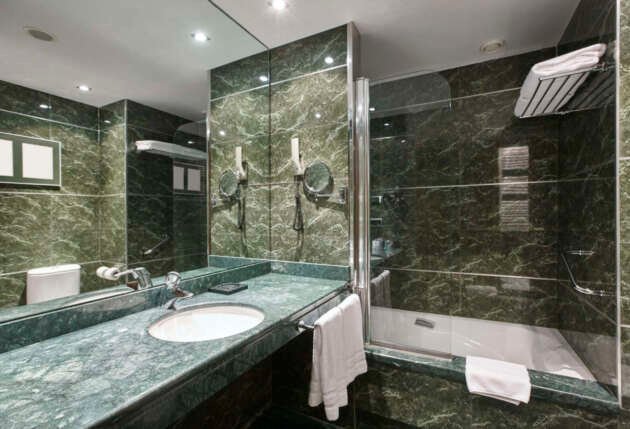 Luxury bathroom in green marble. Decoraton hotel home interior. Horizontal